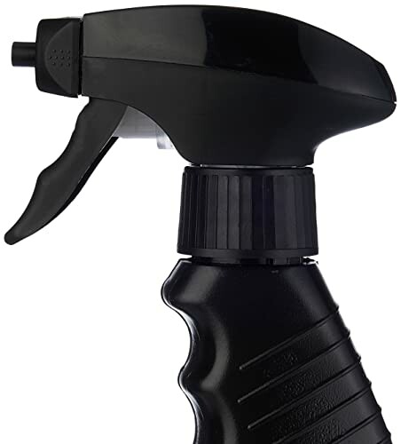 Black spray bottle nozzle with trigger