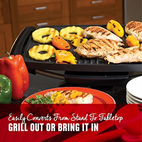 Indoor grill with grilled chicken, peppers, and pineapple slices.