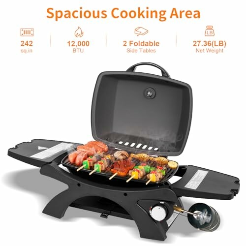 Portable gas grill with open lid, cooking skewers of meat and vegetables.