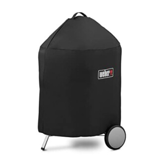 Black grill cover on a wheeled grill